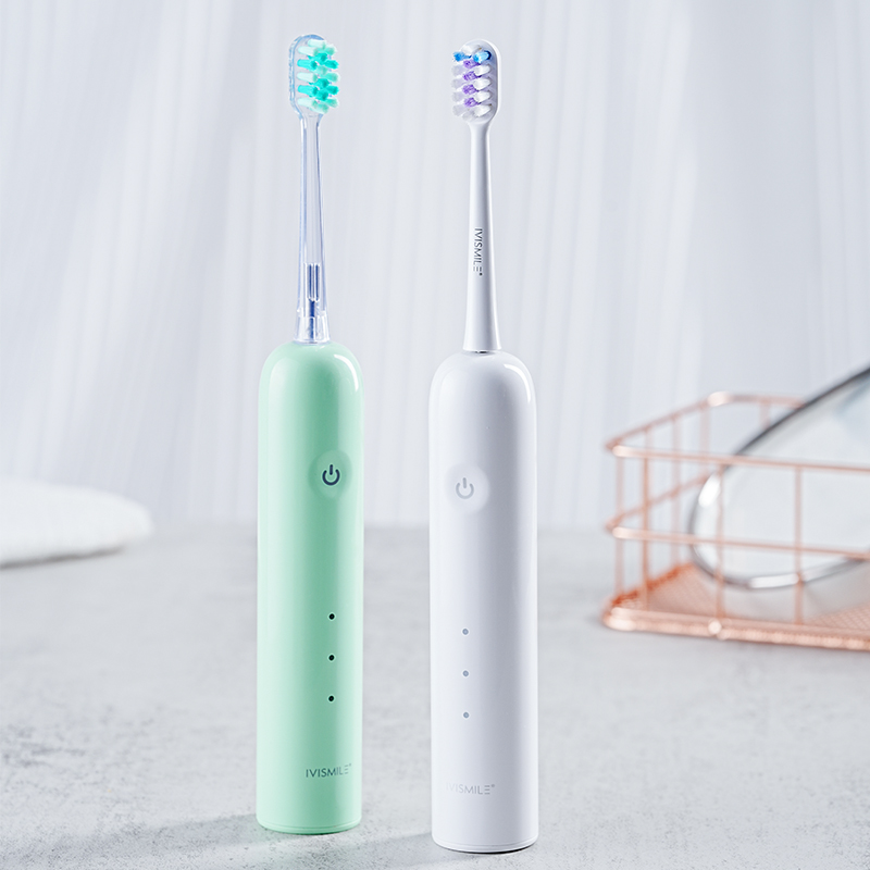 Dos cepillos de dientes eléctricos oscilantes IVISMILE en verde menta y blanco